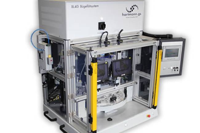 Doppelbügellötsystem mit einem dreifach geteilten Drehteller.